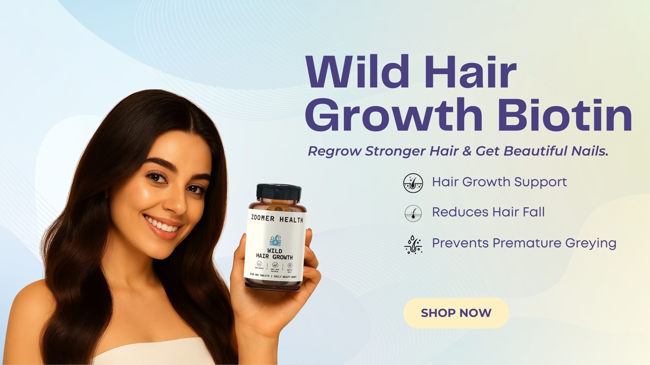 Woman holding a bottle of Wild Hair Growth Biotin Zoomer health with product details on a light blue background